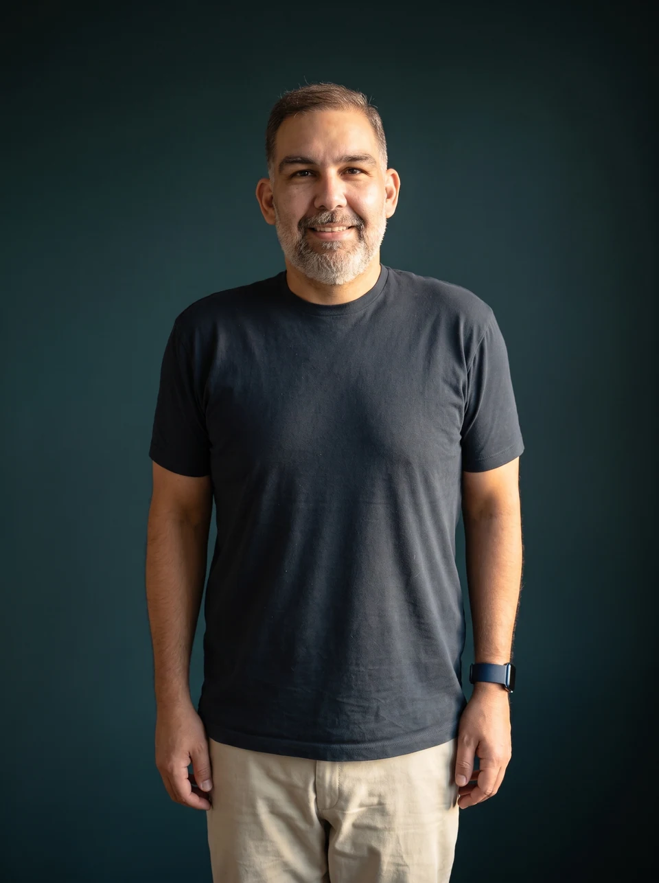 Jaime after losing over 60 pounds, smiling in his navy T-shirt