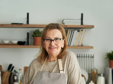Illustrative portrait of a smiling older woman outdoors